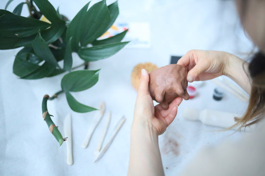 woman holding a clay from Sunday&Clay